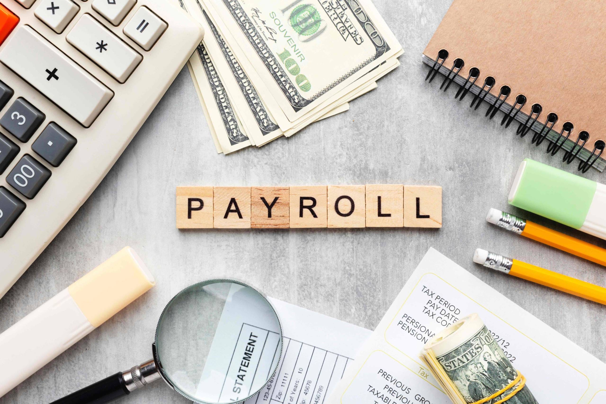 top-view-payroll-concept-with-items_11zon-scaled